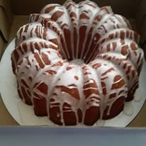 Bundt cake topped with white icing drizzle