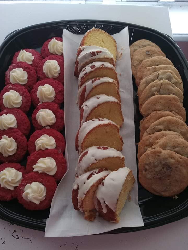 Dessert platter with cookies and sliced iced cake