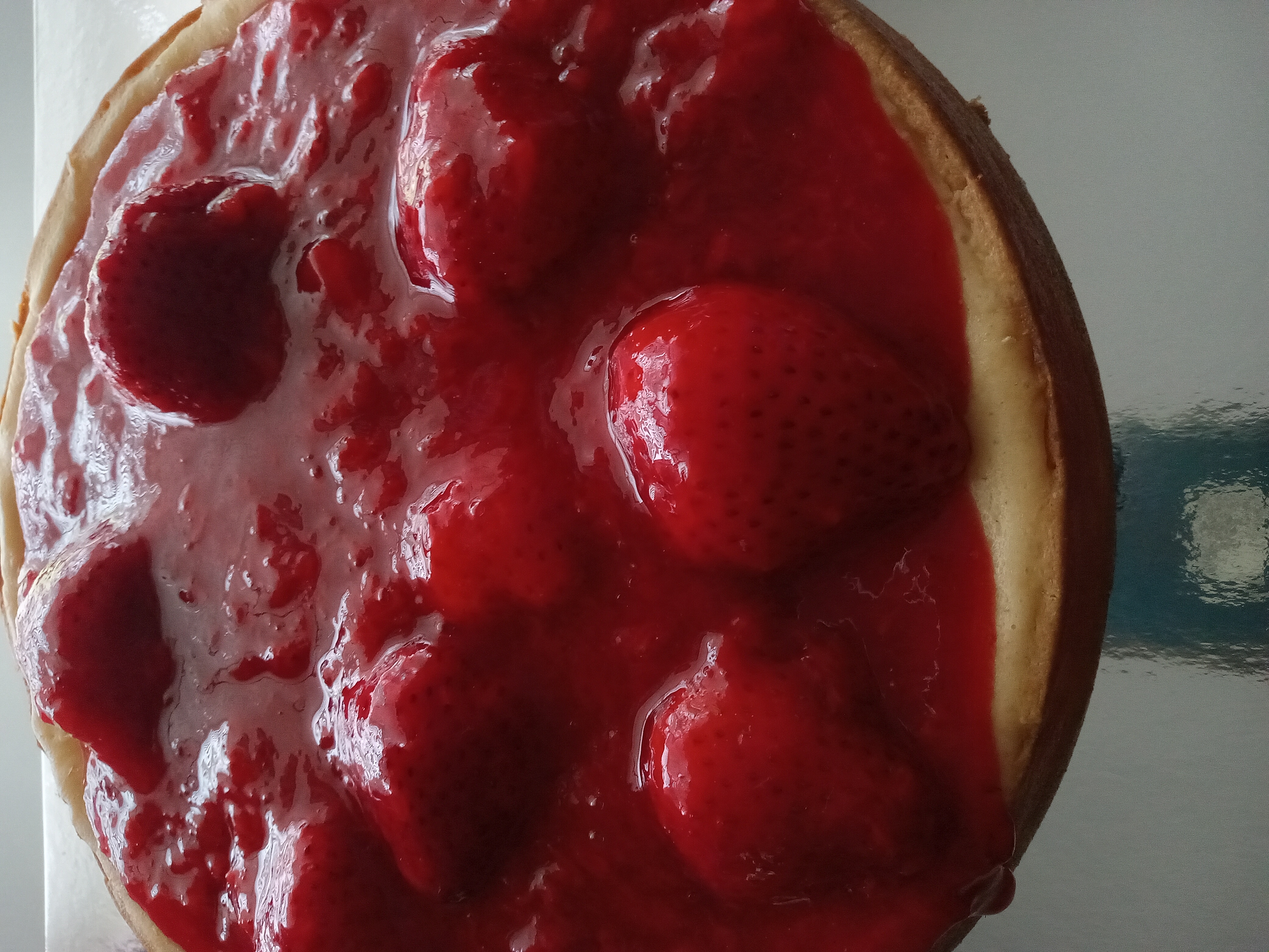 Strawberry cheese cake topped with whole strawberries and strawberry glaze