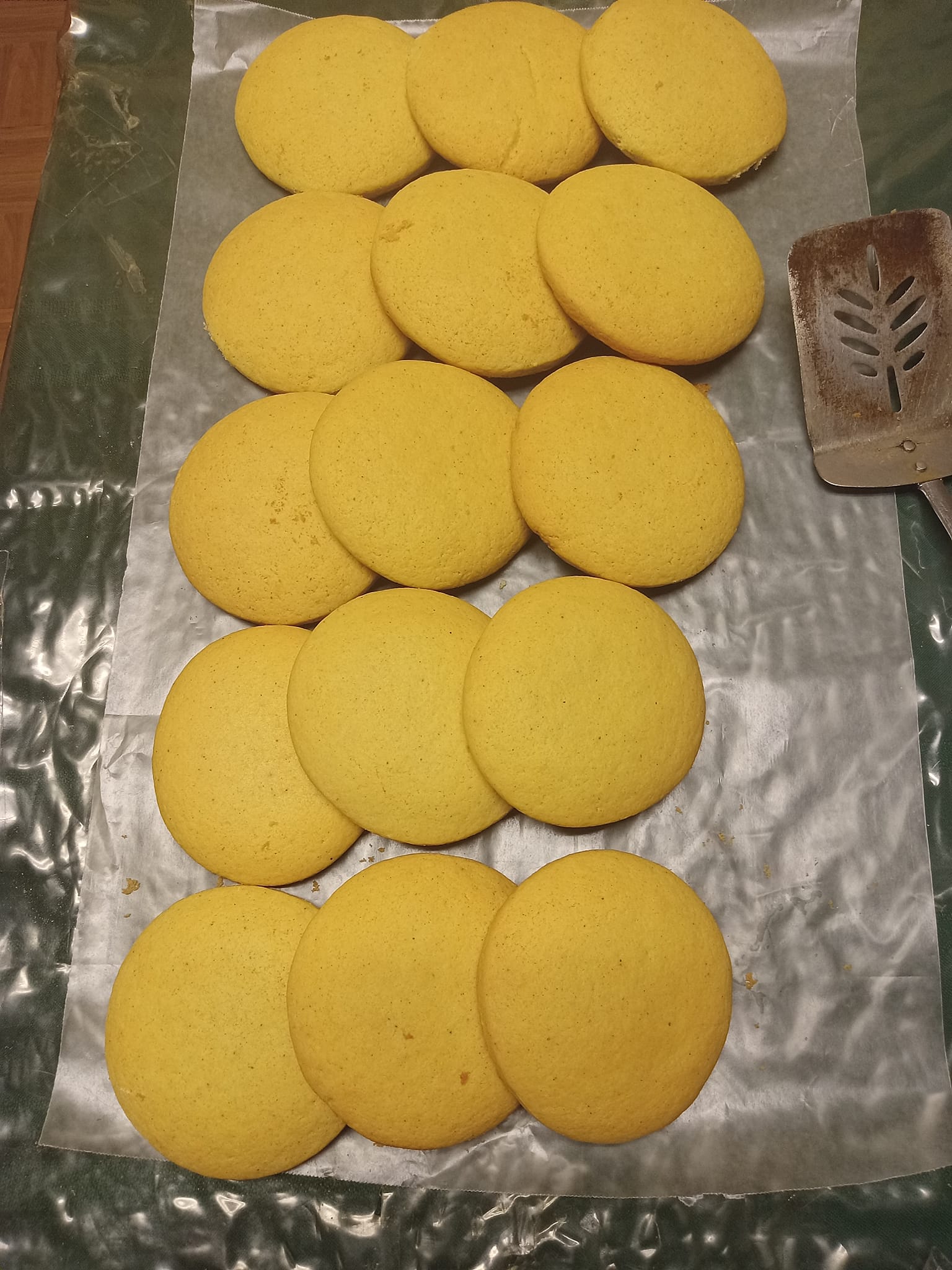 Round tea cakes arranged on foil